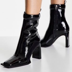 ASOS DESIGN Enchant high-heeled padded boots in black patent